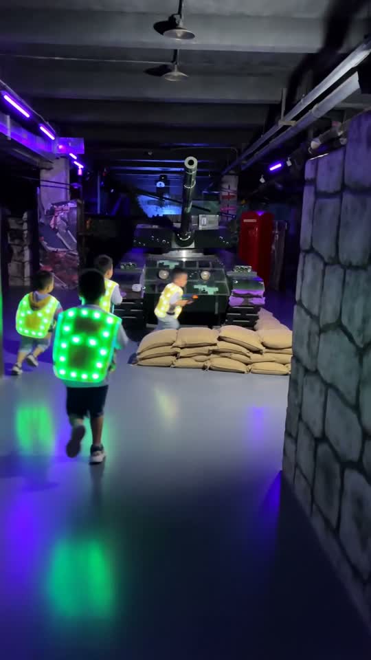 Kids running through the laser tag arena at Les Trois Monkeys.